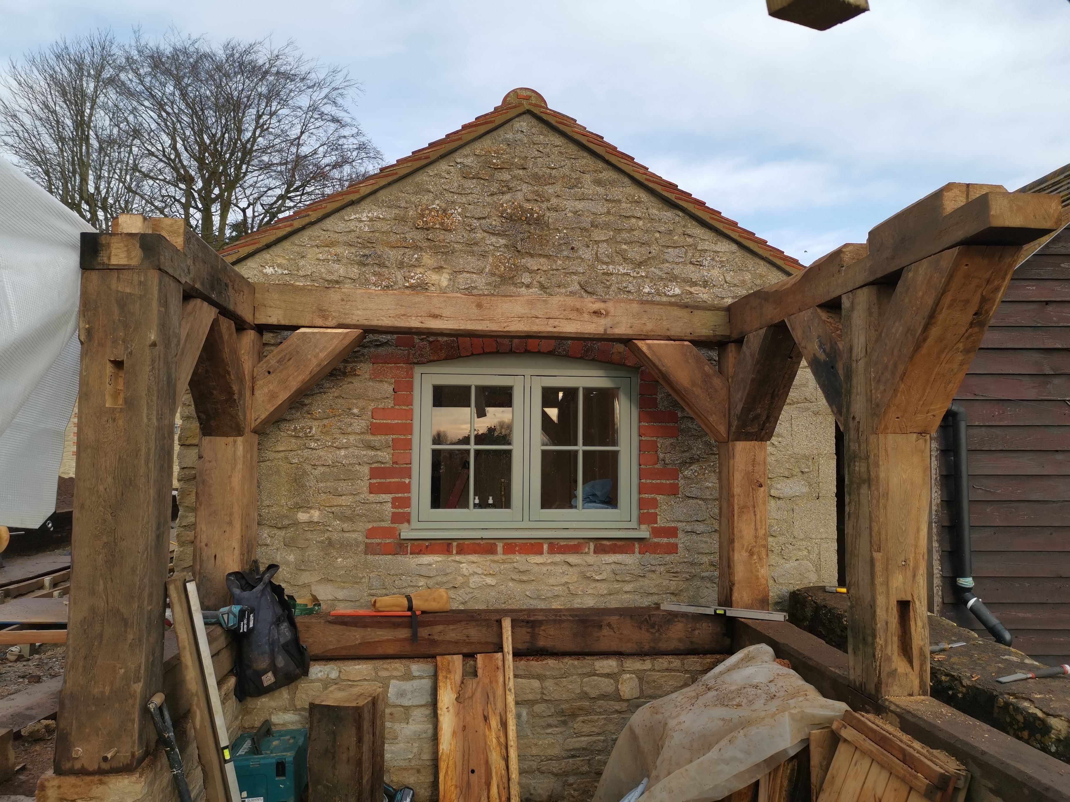 Tools on wooden beams at a cottage window